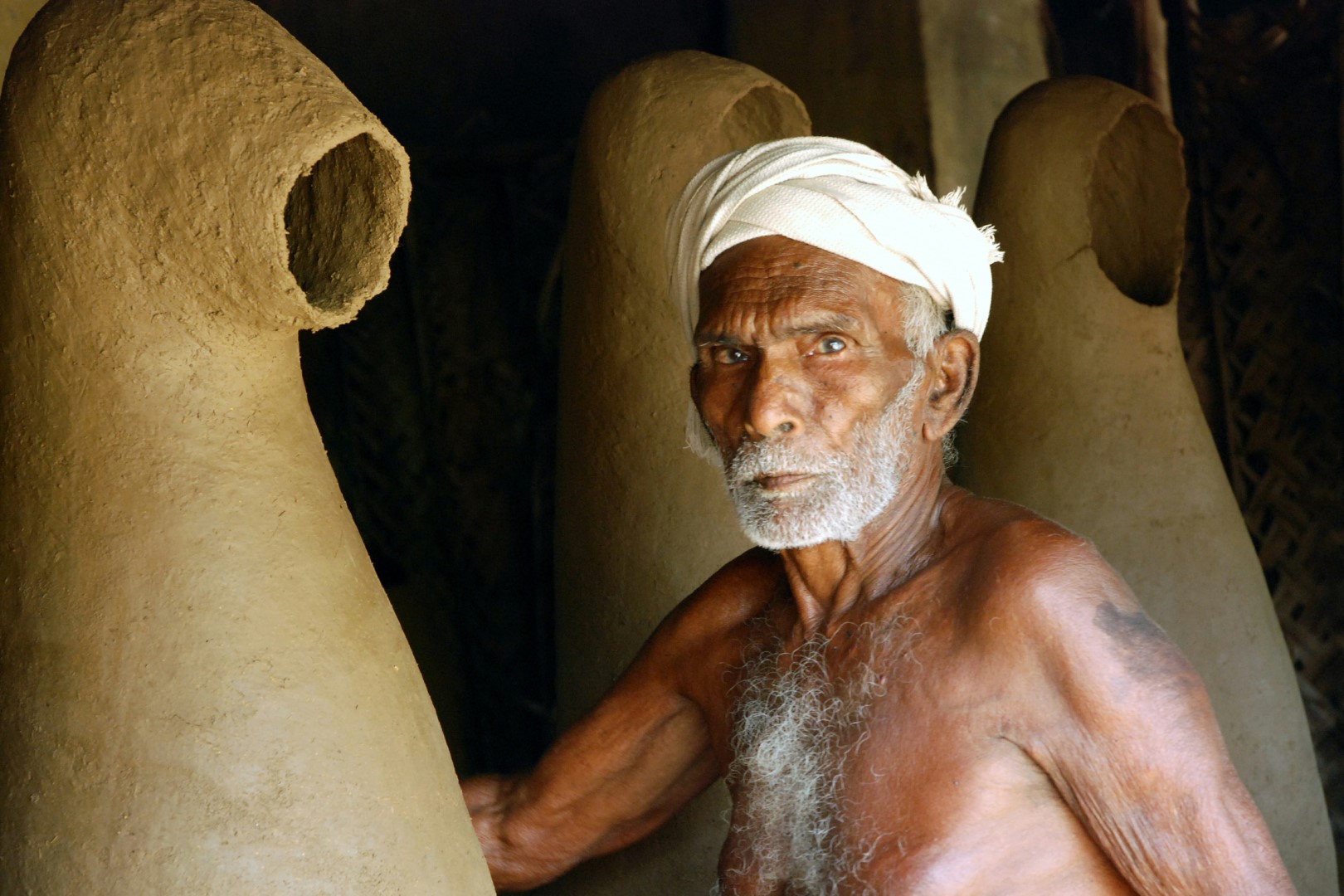 <span style="font-weight:normal;">Manikam, 87 years old when this photo was taken (2010), in his workshop.</span>