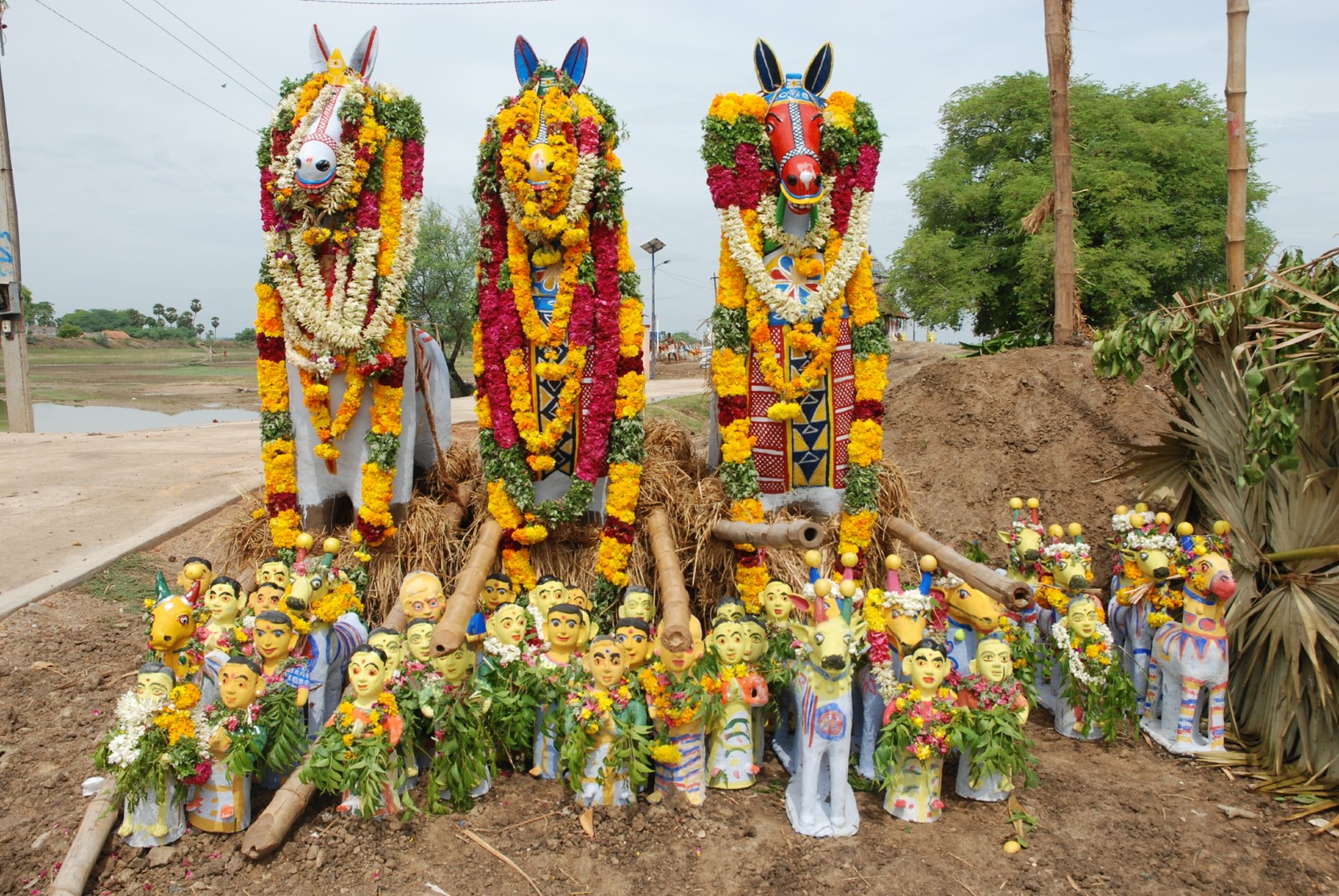 <span style="font-weight:normal;">The day before this photo was taken, these three <i>ure-kutherai</i> (village horses) and numerous smaller offerings left the potters' village and were placed just outside the shrine's gates. They will be carried into the shrine the following evening.</span>