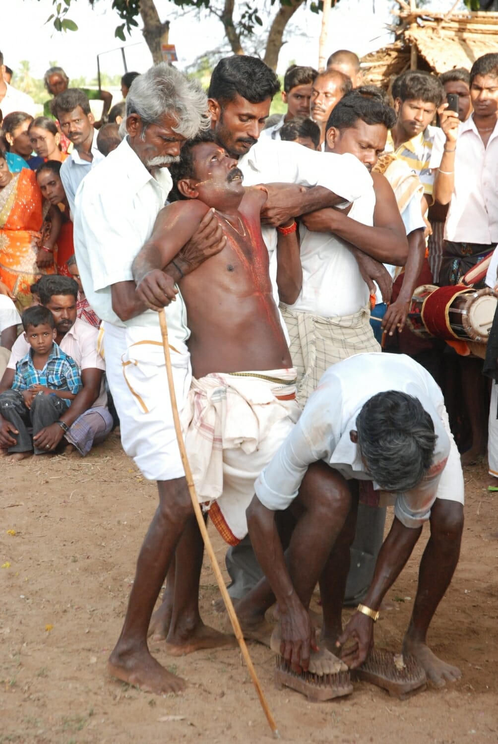 <span style="font-weight:normal;">On the second day at this festival, a <i>sami-attam</i> (dance of the gods) called <i>Elle Sami</i> (Seven Gods) is carried out, where Singaravel incarnates, one by one, seven gods specific to the shrine. This photo was taken right before the dance of the god Sarimuni, who dances on nail-studded sandals with a <i>pujari</i>.</span>