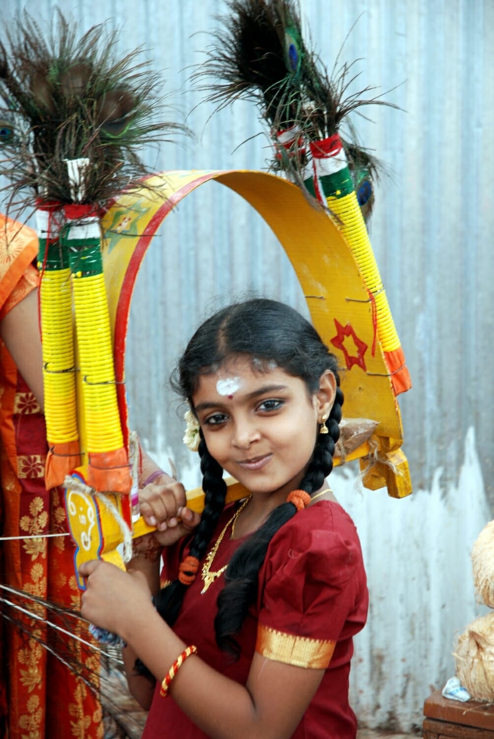<span style="font-weight:normal;">Girl holding Kavadi Panels in Palani, 2013</span>